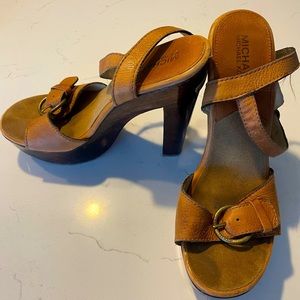 Michael Kors wooden block heels with leather straps.